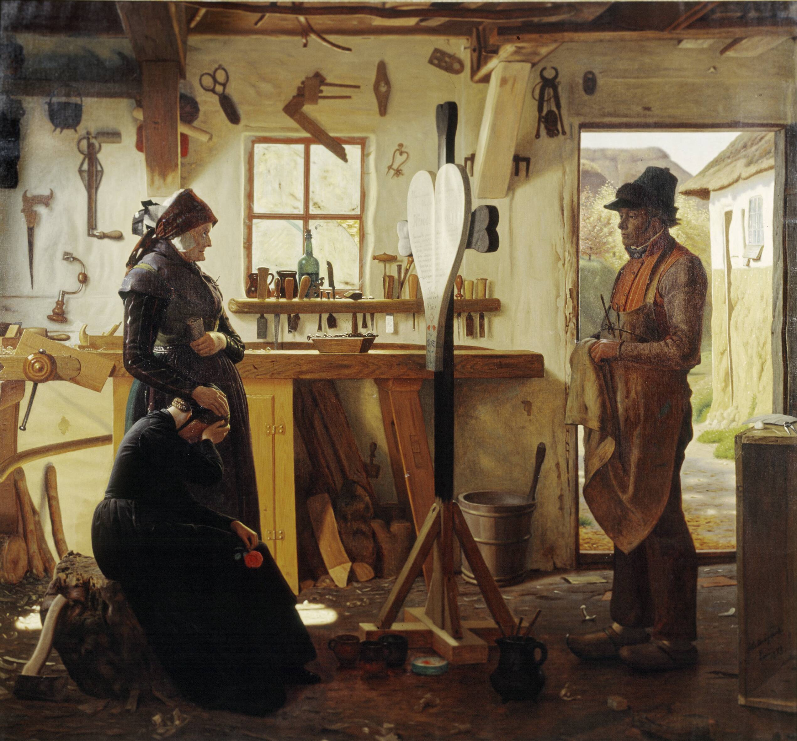 To kvinder besøger landsbykunstneren for at se det bestilte gravkors
