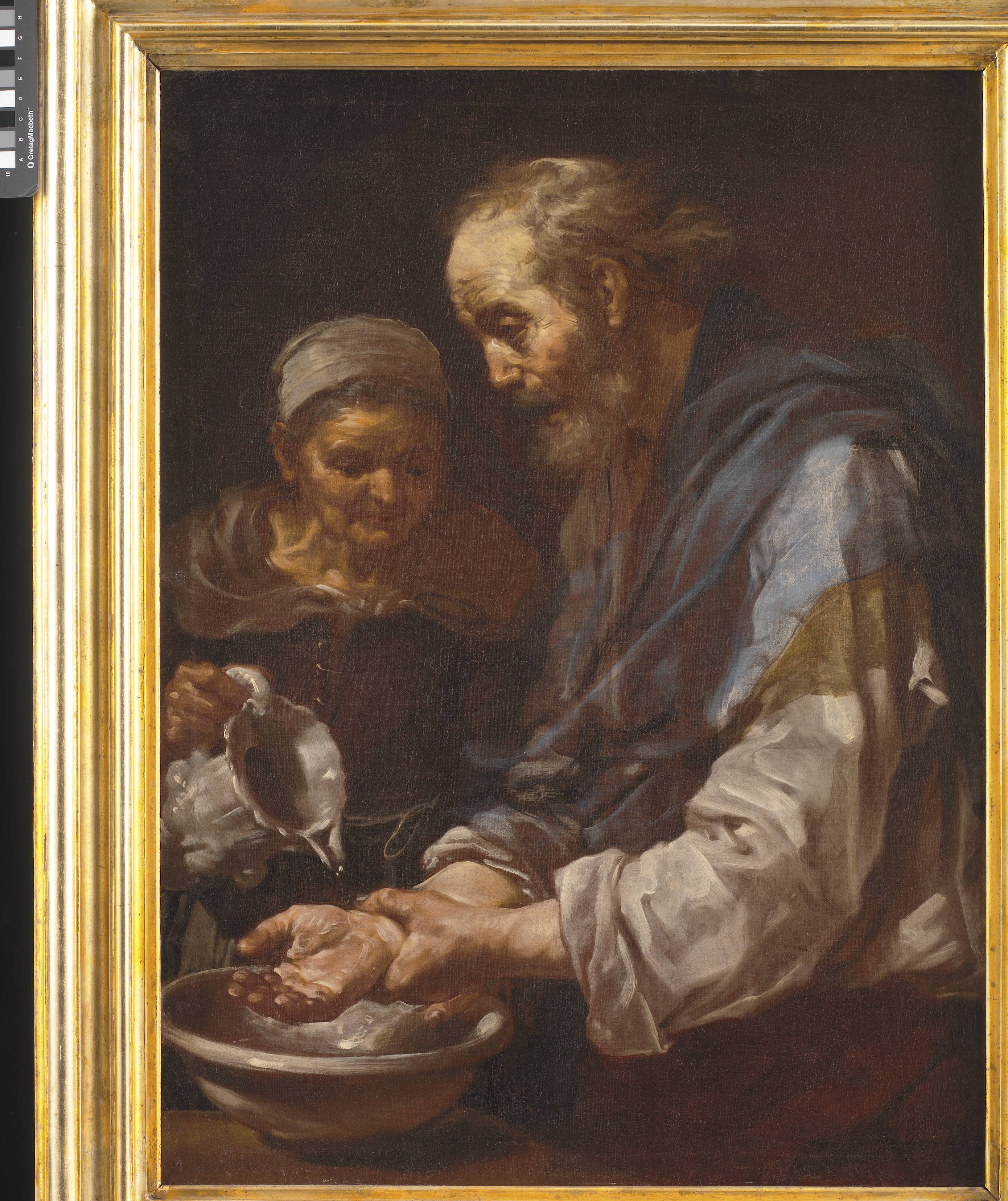 Old man washing his Hands
