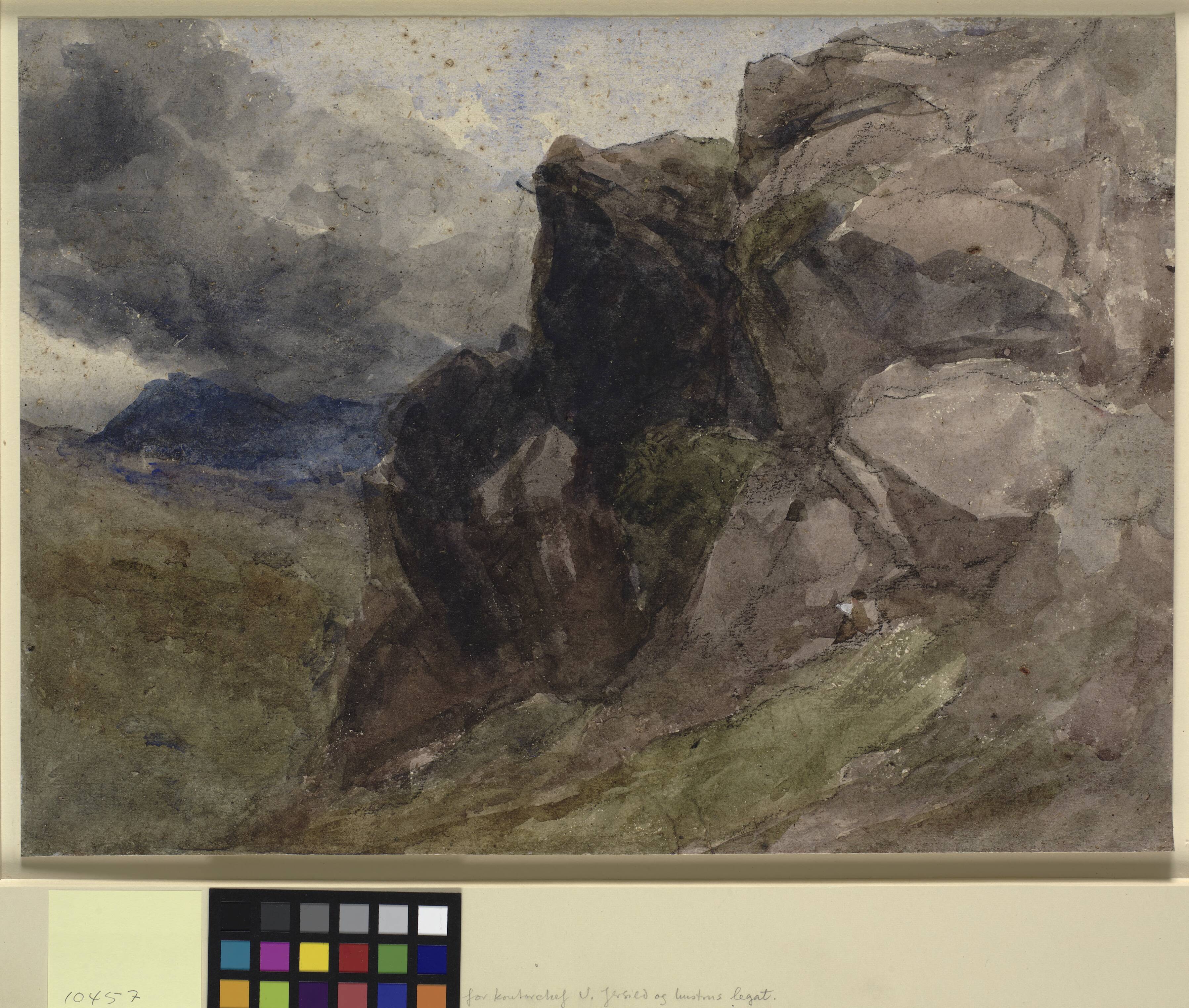 Rocky landscape in Wales with figure drawing in the foreground to the righr