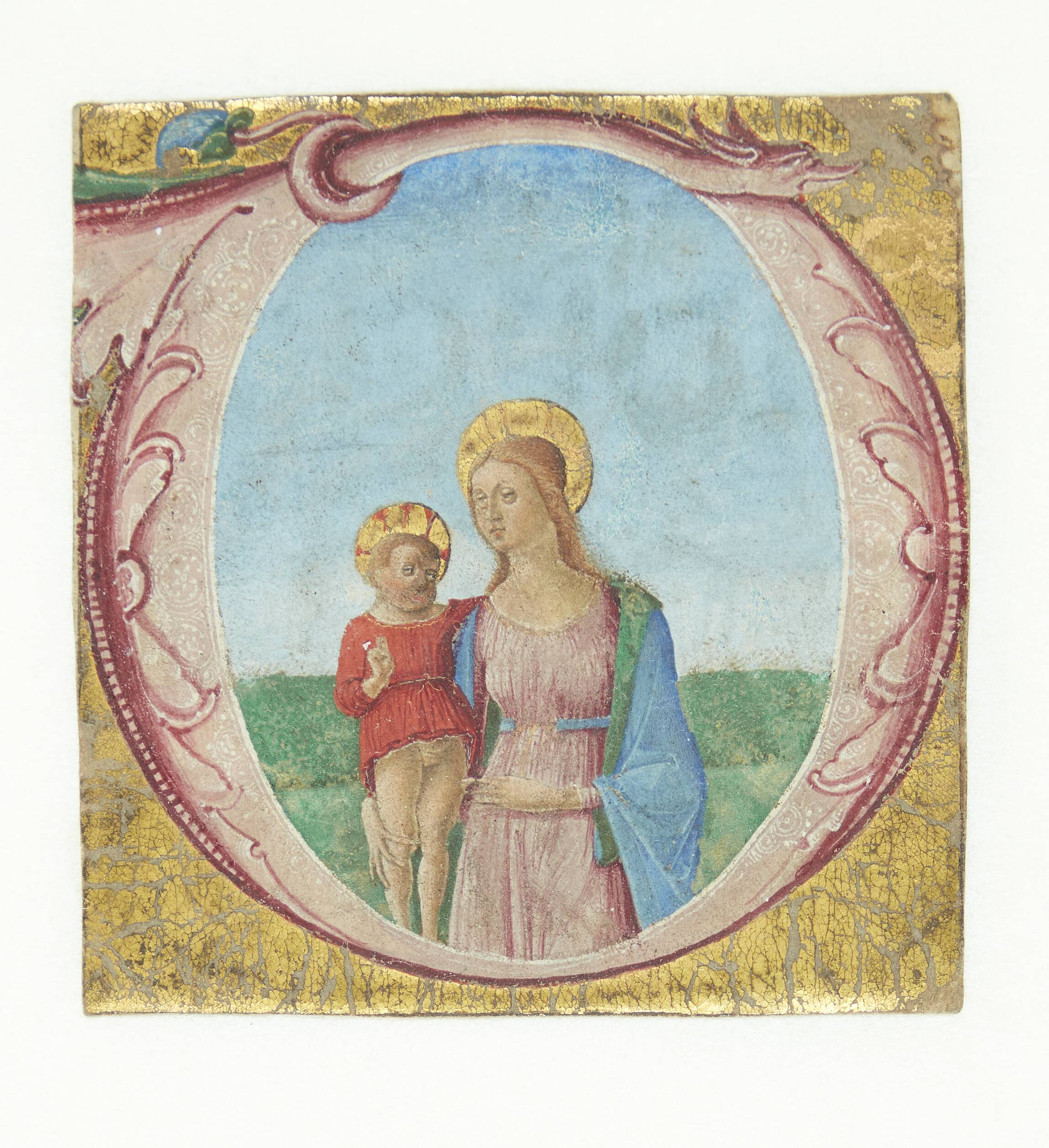 Ornamenteret initial O, hvori bl.a. indgår et dragehoved. I initialen en stående Madonna med barnet i landskab. Udsnit af miniaturehåndskrift.