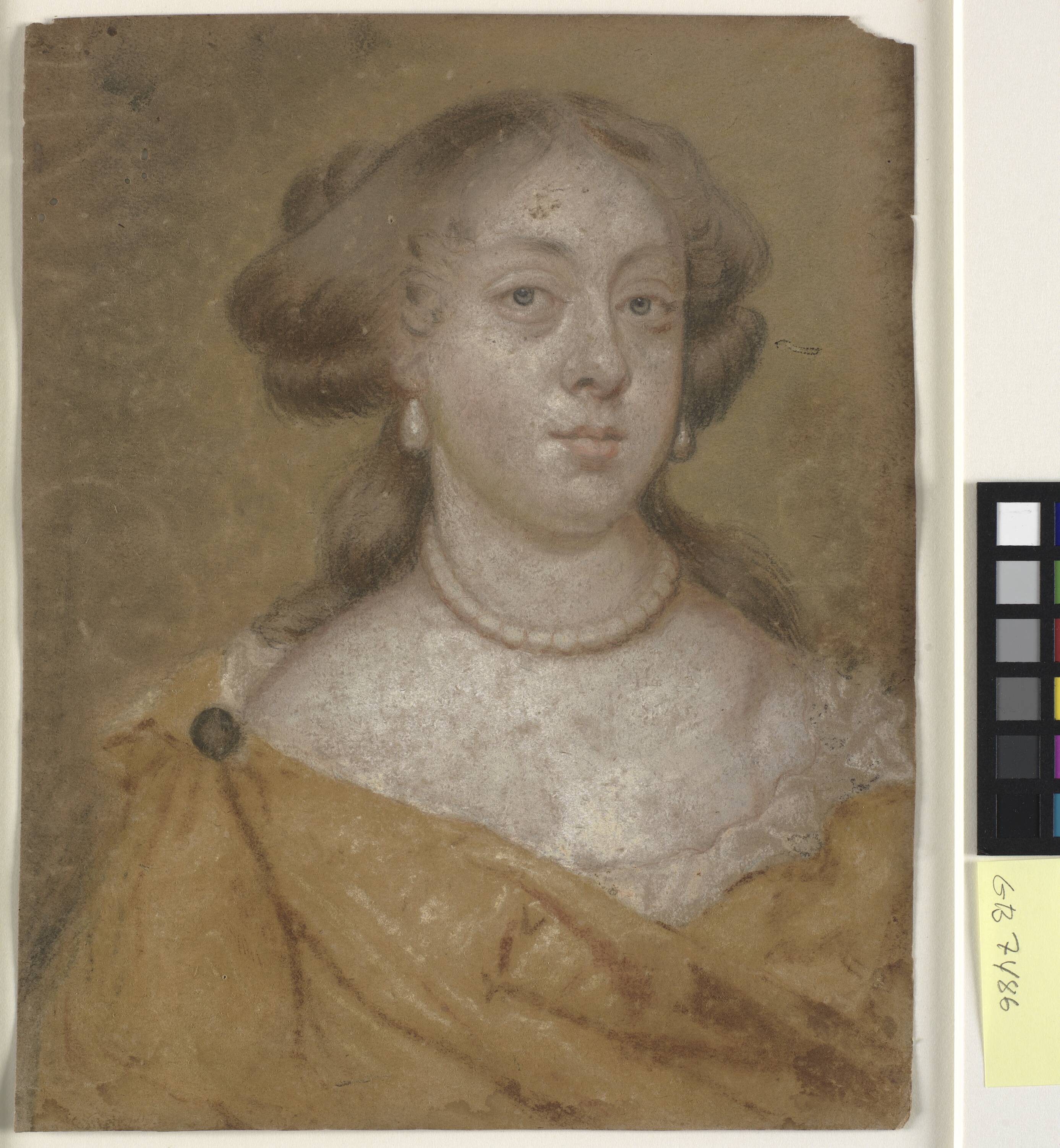 Head and shoulder portrait of a lady with earrings