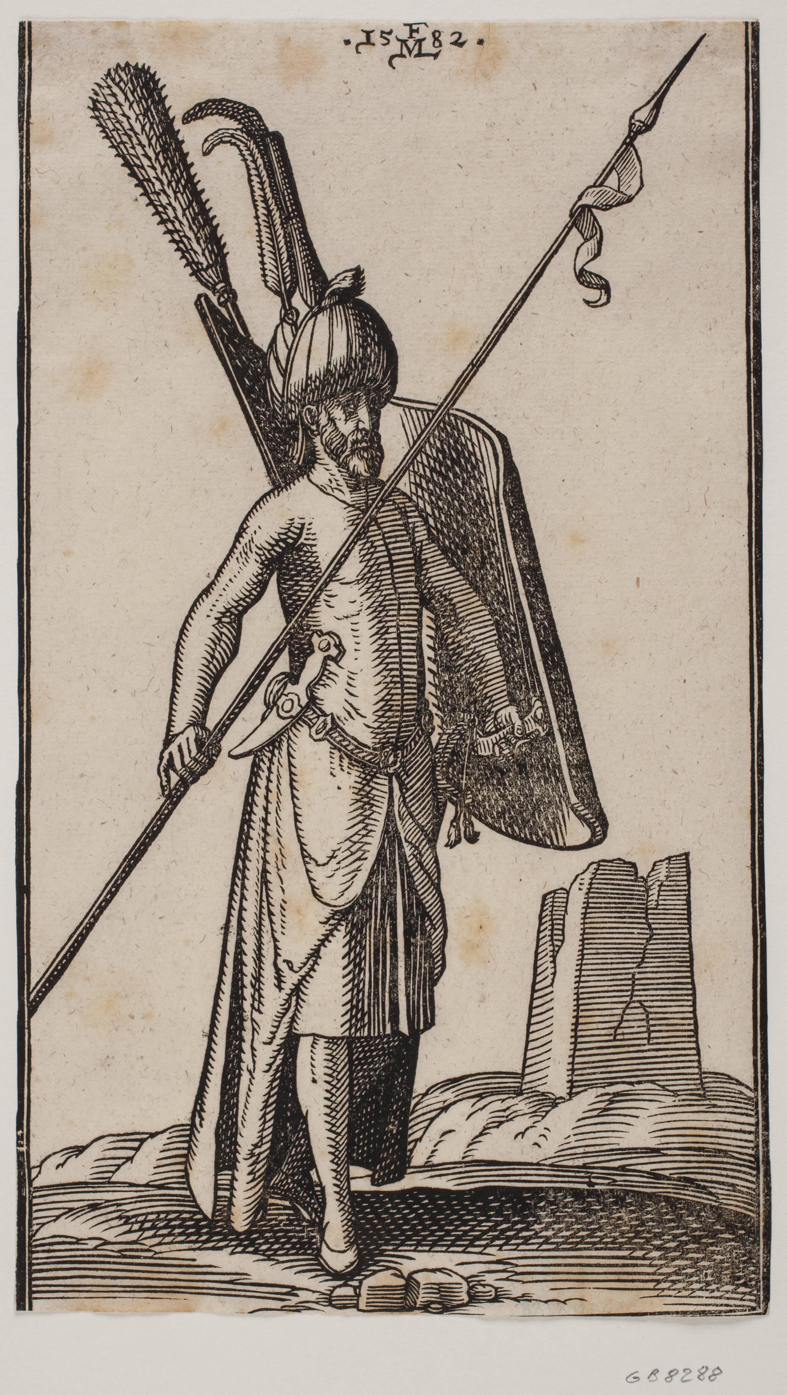 Stående soldat med krumt skjold i v. hånd og i h. hånd et spyd, der holdes skråt; sværd ved hans v. side, en dolk stukket i bæltet ved hans v. side; i baggrunden t.h. ruinen af en obelisk eller et tårn med kvadratisk grundplan