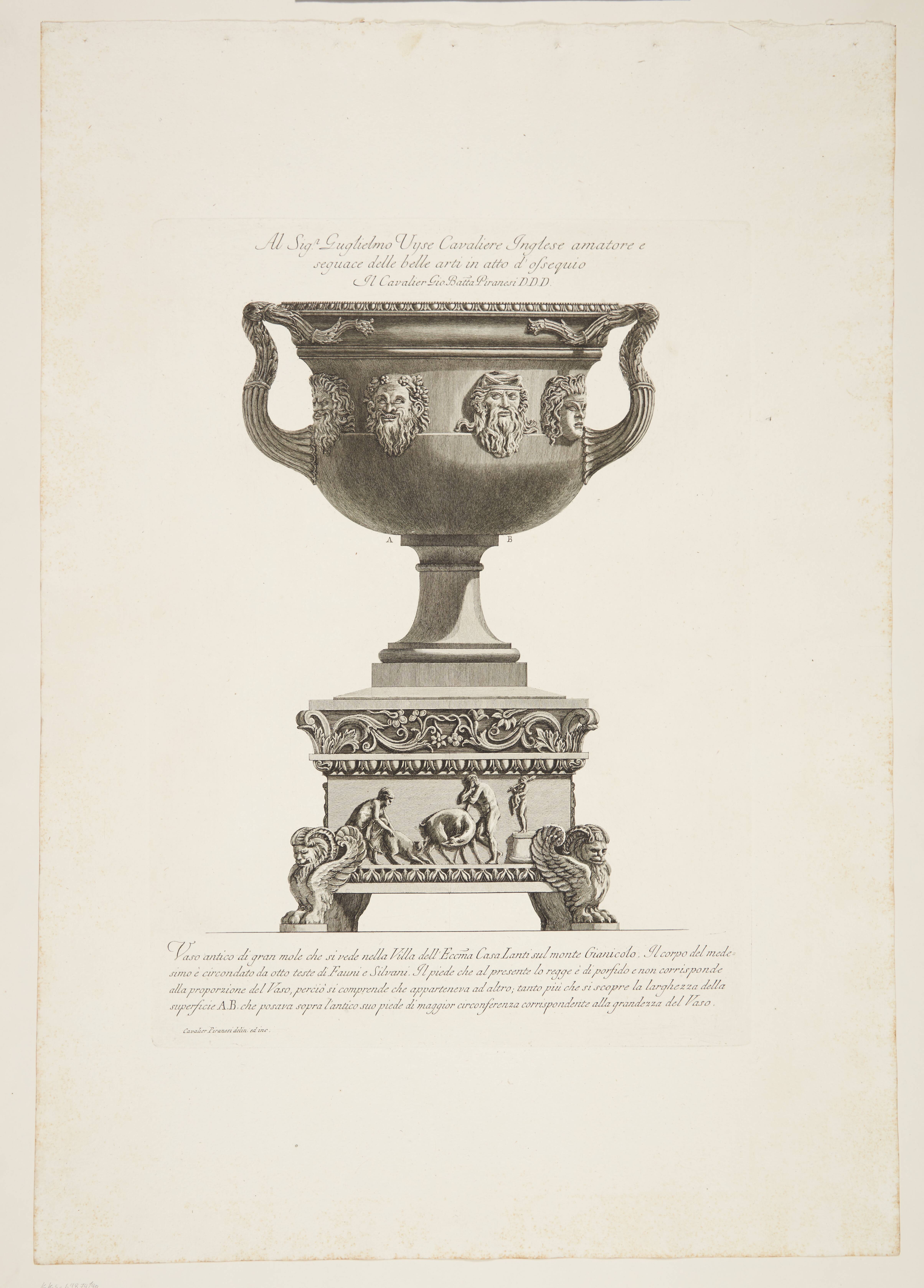 Two handed vase with masks on a base from another such work