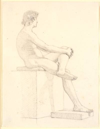 Ung, siddende mandlig model