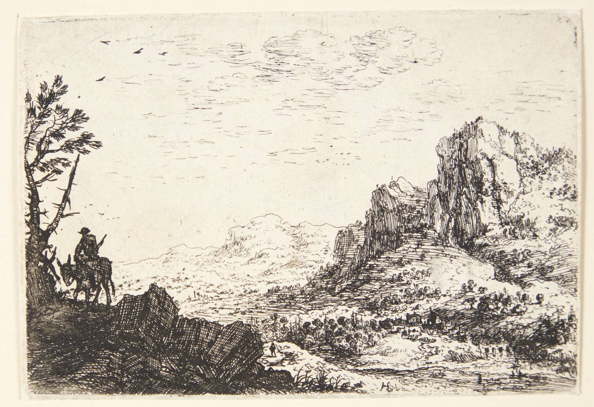 Panorama over bjergrigt landskab, i forgrunden en mand ridende på et æsel