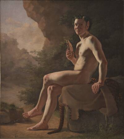 Ung Pan i en grotte. Modelfigur